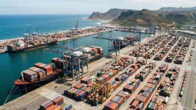 Aerial view of a busy African container port with cargo ships
