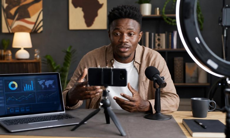 African content creator recording a news explainer