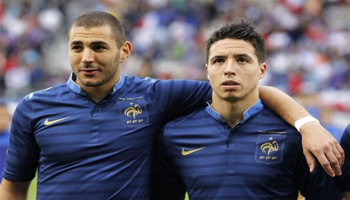 428611-france-s-soccer-team-players-benzema-and-nasri-stand-before-a-friendly-soccer-match-against-serbia-i