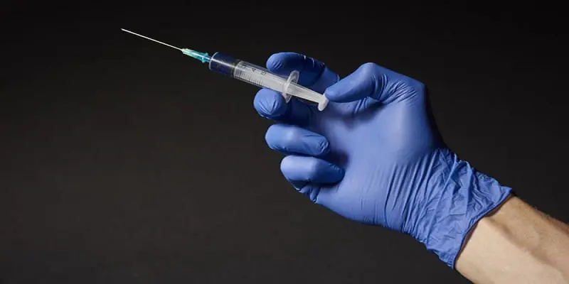 Hand with syringe