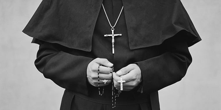 priest with crucifix