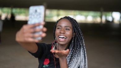Afro young woman taking selfie photos
