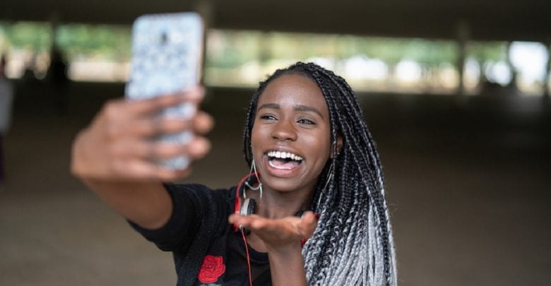 Afro young woman taking selfie photos