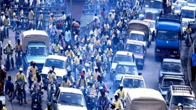 Cotonou, Benin: Heavy traffic beside the Dantopka market of Cotonou. Dantopka is the largest market in west africa. –