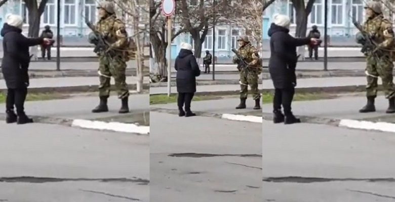 Une dame affronte un soldat russe