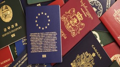 Mixed-biometric-passports-of-many-countries-of-the-world.-In-the-foreground-is-a-European-Union-passport.