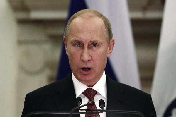 Russian President Putin reads a joint statement with India’s Prime Minister Modi after their delegation level talks at Hyderabad House in New Delhi