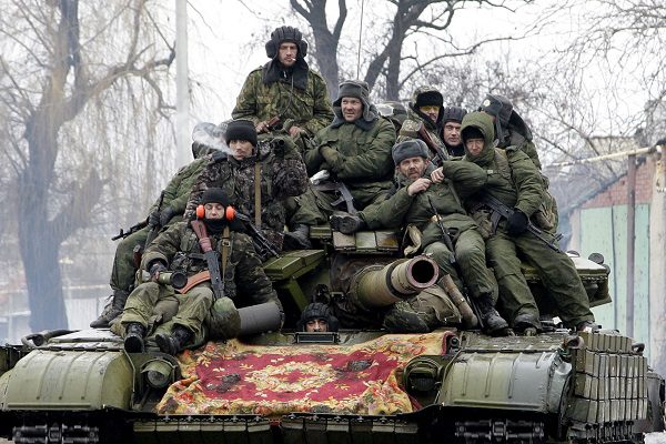 Members of the armed forces of the separatist self-proclaimed Donetsk People’s Republic drive a tank on the outskirts of Donetsk