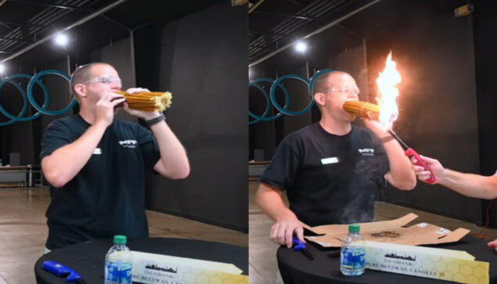 un homme allume 150 bougies dans sa bouche