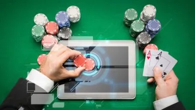 casino poker player with cards, tablet and chips