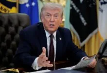 U.S. President Trump signs an executive order in the Oval Office of the White House