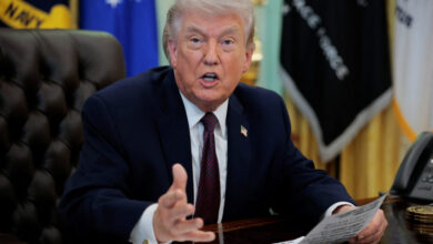 U.S. President Trump signs an executive order in the Oval Office of the White House