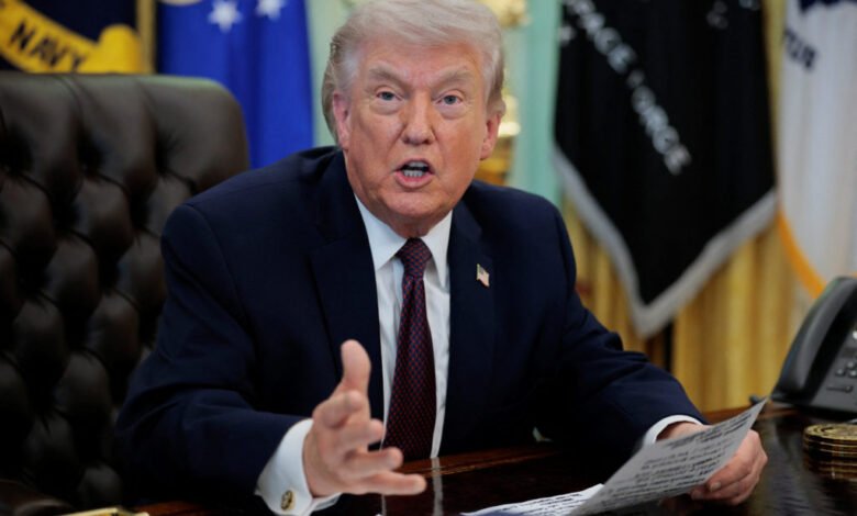 U.S. President Trump signs an executive order in the Oval Office of the White House